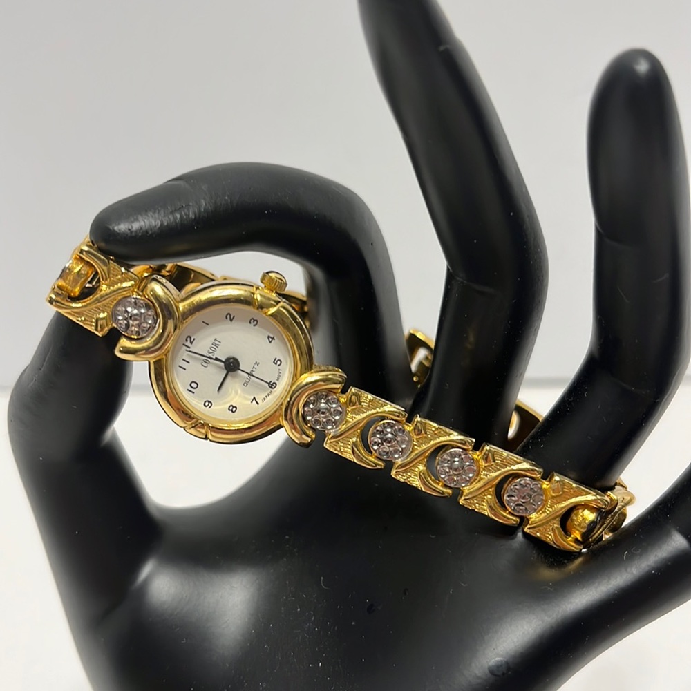 Woman’s Consort Gold Tone Watch with Silver Tone Embellishment. New battery.